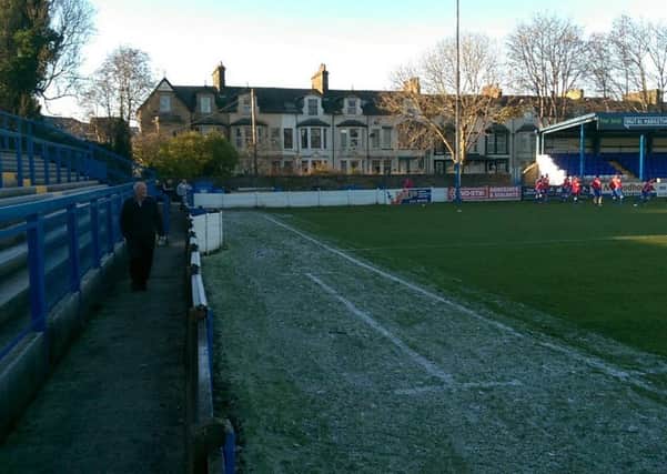 The area of the Lancaster City pitch that caused concern. The players can be seen training in the background.