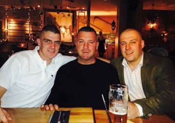 Neil Marshall with his brothers Paul and Scott.