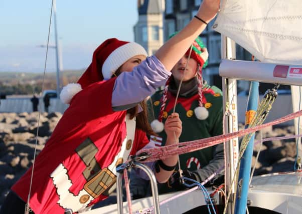 April and Jamie Whiteley get into the Christmas spirit preparing their Kestrel dinghy for Morecambe Sailing Clubs Turkey Chase meeting.