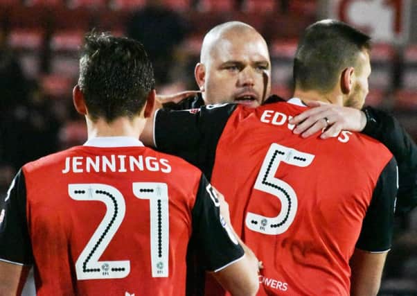 Jim Bentley congratulates his players on the win over Plymouth.