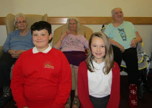 Ethan Holleley and Abbie Turner (both 10) from Sandylands with Hillcroft residents Edwina Barnes, Jean Dougherty and Joan North.