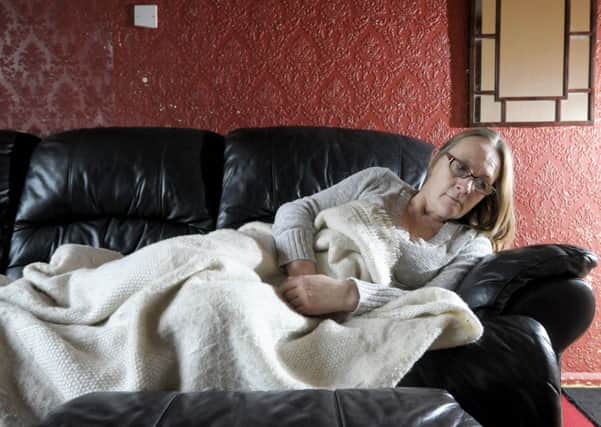 Helen Reid has been suffering with health problems due to damp in her council house.  It has gotten so bad she has had to sleep in her living room for the past six months.