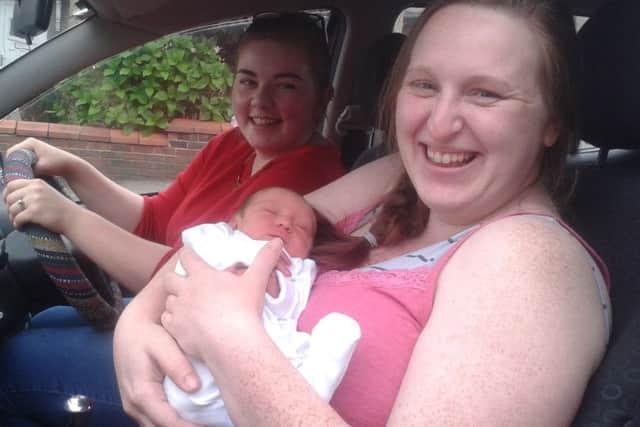 Vicki Davis with baby Dean, who was born in her friend's Toyota Yaris on the Pointer roundabout. Pictured with friend Amanda Bray.
