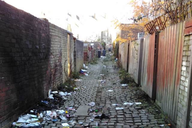 An alleyway in the West End before the clean-up.