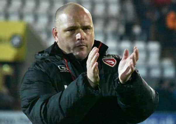 Jim Bentley applauding the fans after a recent game. Photo by Mike Williamson.