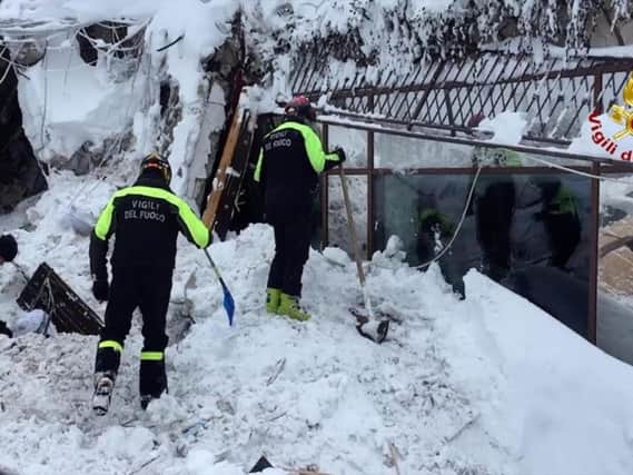 Italian firefighters search for survivors after an avalanche buried a hotel near Farindola, central Italy