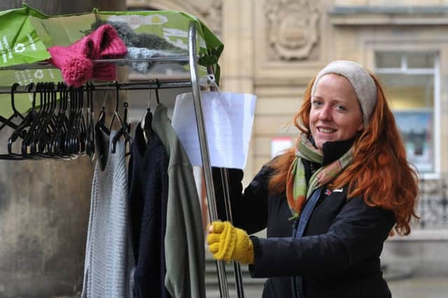 Photo Neil Cross
Anna Hopkinson with the coat rail outside Lancaster library which she has put there to help homeless people