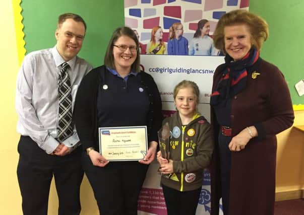 Rachel Heywood, Lancaster Brownie with her parents (left) and region president.