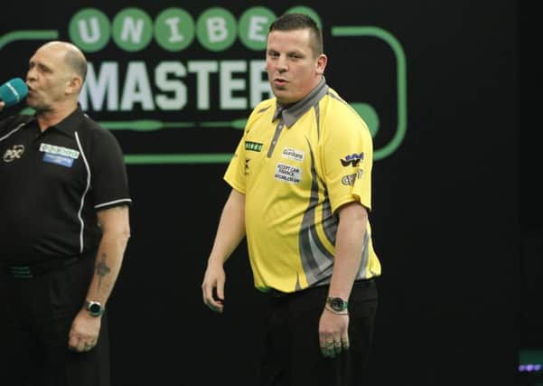 Dave Chisnall rues a missed opportunity against Raymond van Barneveld. Picture: Lawrence Lustig