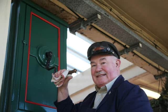 Jim Walker pictured when he used to wind up Carnforth Station clock.