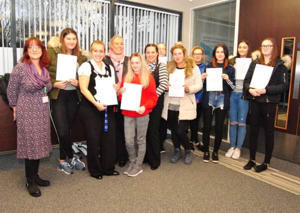 Lancaster and Morecambe College travel students and their tutor with their NCS certificates.