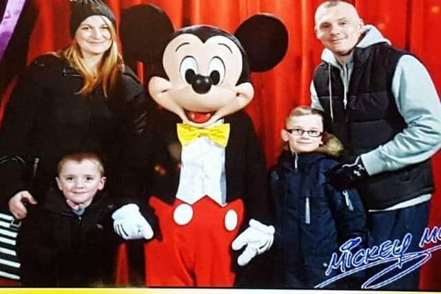 Justine and Chris McCarthy with Reilly, four, and Carter, six, at Disneyland Paris.