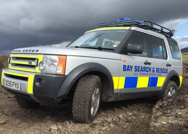 The Bay Search and Rescue team helped a man after a crash outside their charity shop.