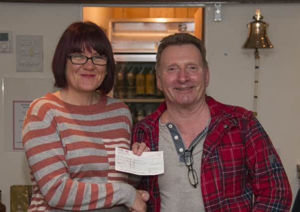 MSC Rear Commodore, Phil Preston, presents a cheque for Â£175 to Lisa Preston of St John's Hospice, Lancaster.