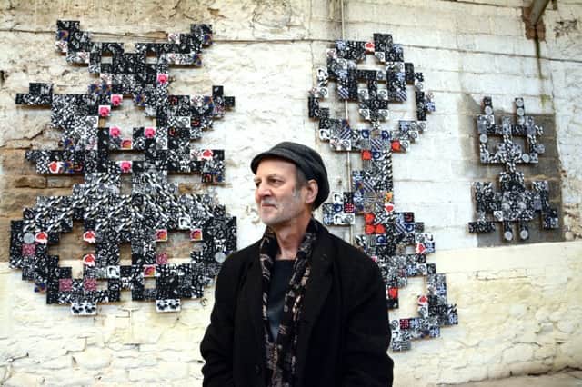 Textile artist Michael Brennand-Wood with his work which appears at the exhibition. Picture by Darren Andrews.