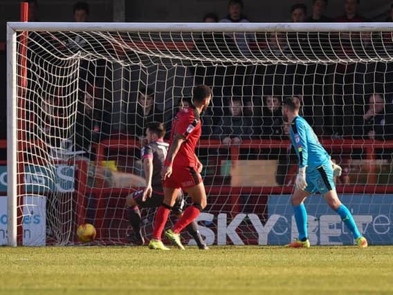 Rhys Turner opens the scoring for Morecambe at Crawley. Picture: PW Sporting Photography
