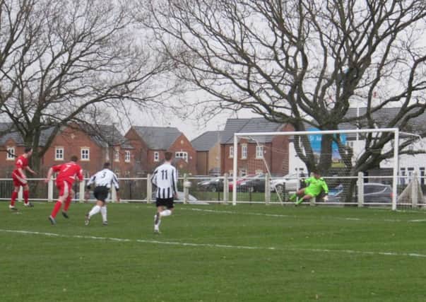 Alex Colquhoun scores from the spot for Garstang against Lostock St Gerards.