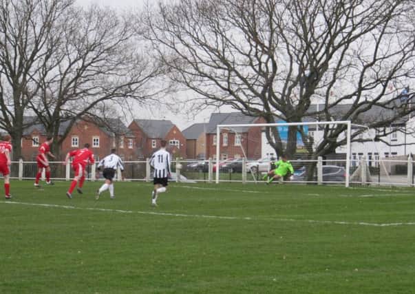 Alex Colquhoun scores from the spot on Saturday.