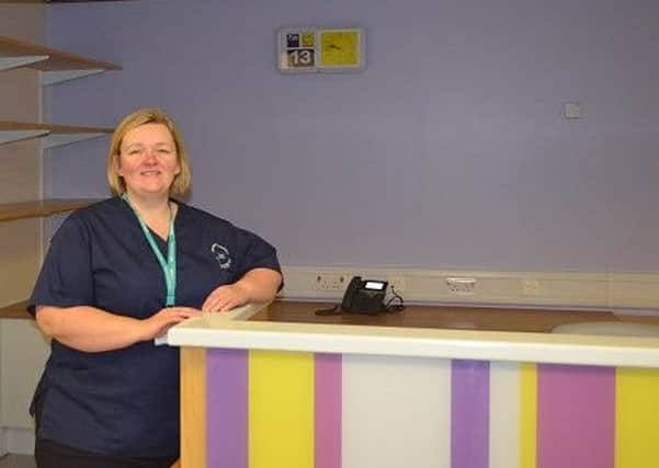 Linda Dunn at the nurses station at the Huggett Suite.