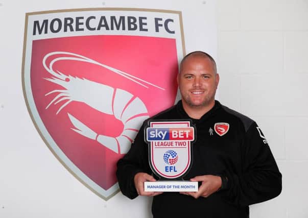 Jim Bentley with his Manager of the Month award in August 2016. The Morecambe boss has also won our 2017 Ambassador Award.