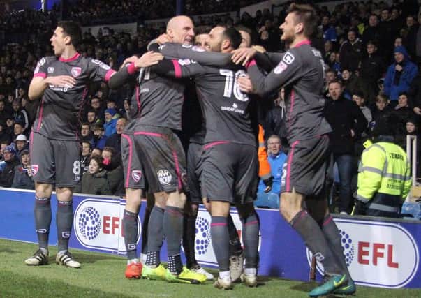 Lee Molyneux is congratulated on his equaliser at Fratton Park.