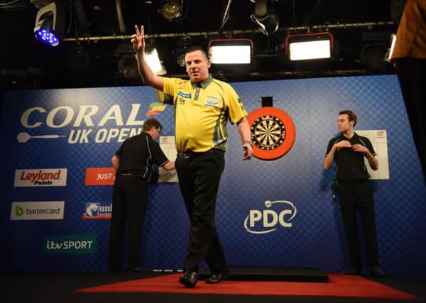 Dave Chisnall celebrates victory over Jamie Caven. Picture: Christopher Dean/PDC
