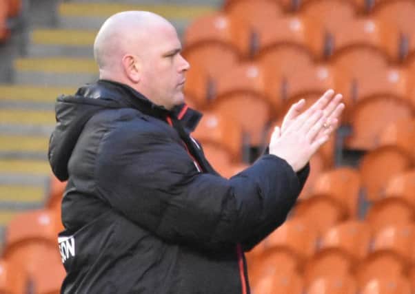 Jim Bentley salutes the fans after the game at Blackpool.
