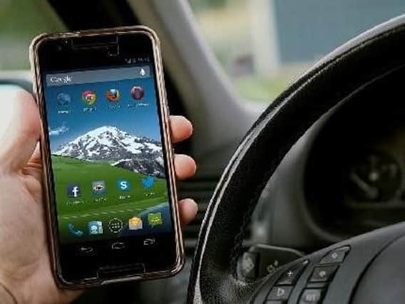 New mobile phone rules saw 77 Lancashire drivers fined and given 6 penalty points for using phone while driving