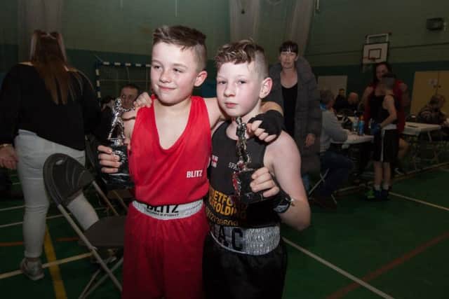 Blaze Havoc Harcourt with opponent Mackenzie Moore at the Coastal Amateur Boxing Club show at Lancaster and Morecambe College. Photo by Rachel Landsborough.