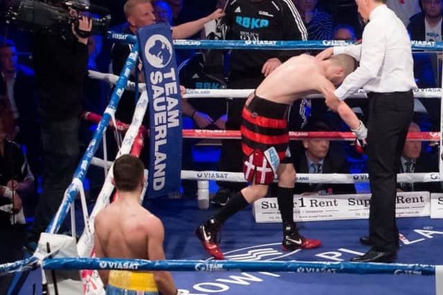 Dennis Ceylan is wobbled by the head clash that ended the fight.