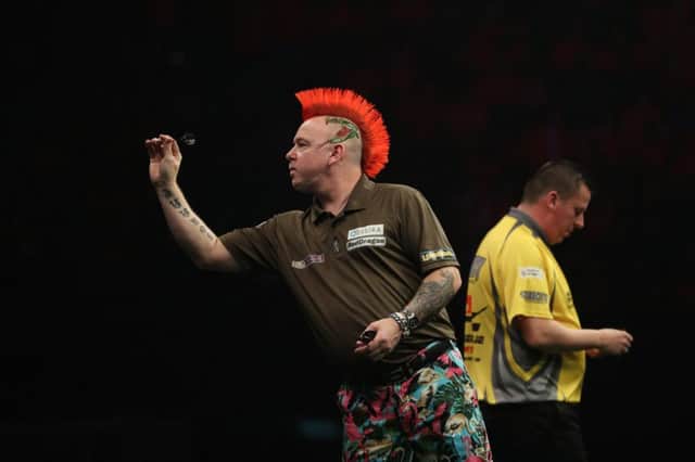 Peter Wright (left) beat Dave Chisnall (right) in Rotterdam on Thursday night in the Betway Premier League. Picture: Lawrence Lustig.