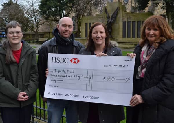 Val Isherwood(right) from The Tigerlily Trust was presented with a cheque for Â£350 by Lancaster City Council Revenues and Benefits Officers Jenny Lawton, and Fiona Byrne (with husband Shane).