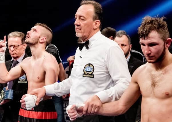Dennis Ceylan retained his European featherweight title after clashing heads with Isaac Lowe.