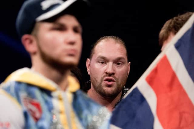 Tyson Fury looks on ahead of Isaac Lowe's European title fight in Denmark.