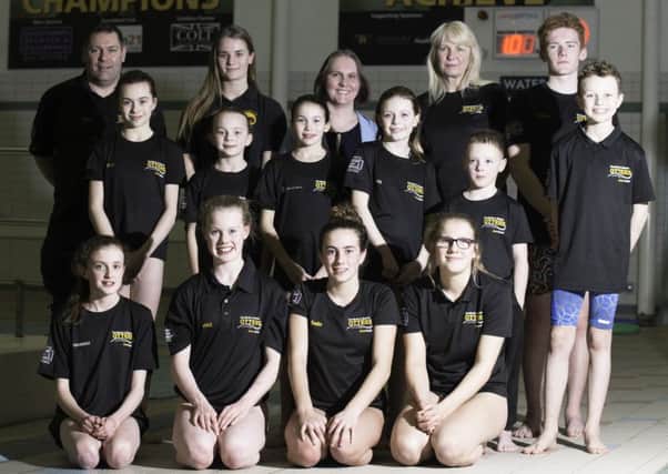 Back Row from Left to Right, Noel Evans (Coach), Holly Salisbury (Club Captain), Jennifer Grabowski (OSG Solicitors), Jill White (Coach) and Richard Mead (Club Captain) with a group of swimmers from the Competitive Swimming squads at Carnforth Otters.
