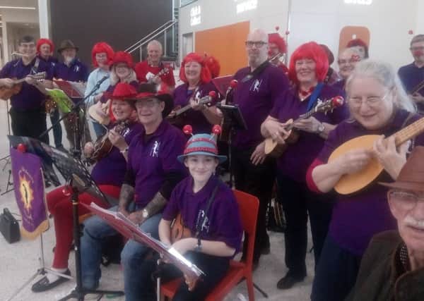 Members of Morecambe Ukulele Club who entertained shoppers at Sainsburys in Morecambe with songs to raise money for Comic Relief.