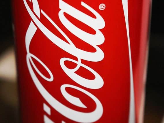 Police are investigating reports that a consignment of cans due to be used at a Coke factory were contaminated with suspected human waste.