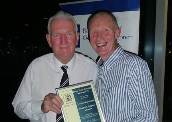 From left: Former Manchester United keeper Alex Stepney presenting Dr Pete Nightingale with his RCGP award.