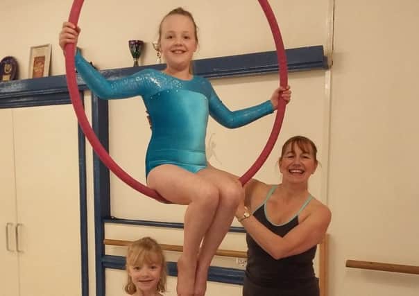 New students (Alicia and Jenny Bowyer) at the Acrobatics Arts Class with teacher Miss Gail Johnstone.