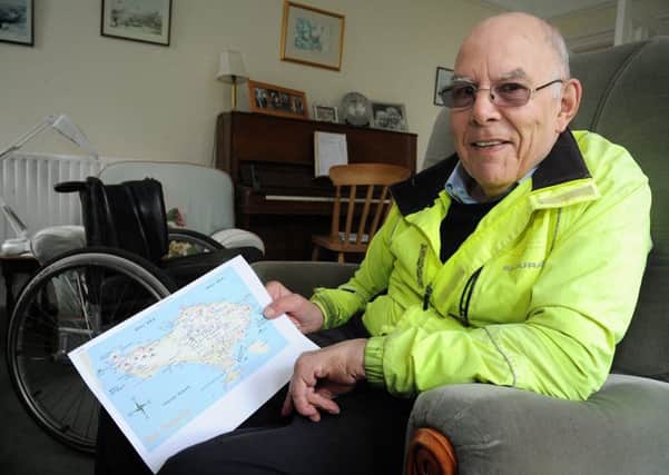 John Mackness from Burton-in-Kendal, who was paralysed by a rugby accident, will be handcycling round Bali to raise money for a tetraplegic sports charity.
John with a map of Bali.   PIC BY ROB LOCK
10-4-2017