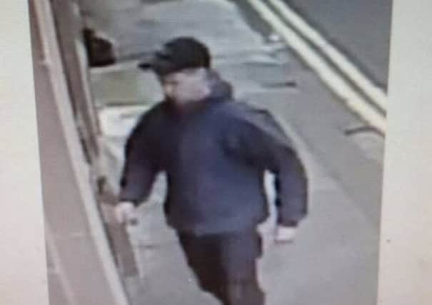 Police want to trace this man after a suspicious cash withdrawal.