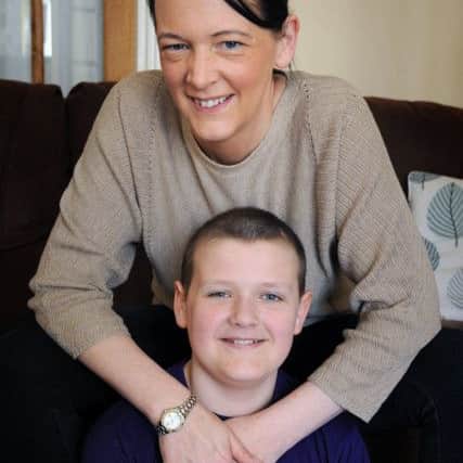 Reece Holt, of Church Park in Overton, is nearing the end of a gruelling course of chemotherapy following his brain tumour diagnosis last year.
Reece with mum Rachel.  PIC BY ROB LOCK
10-4-2017