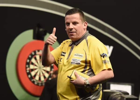 Dave Chisnall celebrates victory over Adrian Lewis. Picture: Michael Cooper