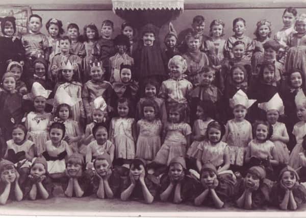 Taken from Ann Burgess's collection oflSt Joseph's Catholic Primary School in Lancaster. This picture shows children gathering for a concert at Christmas.