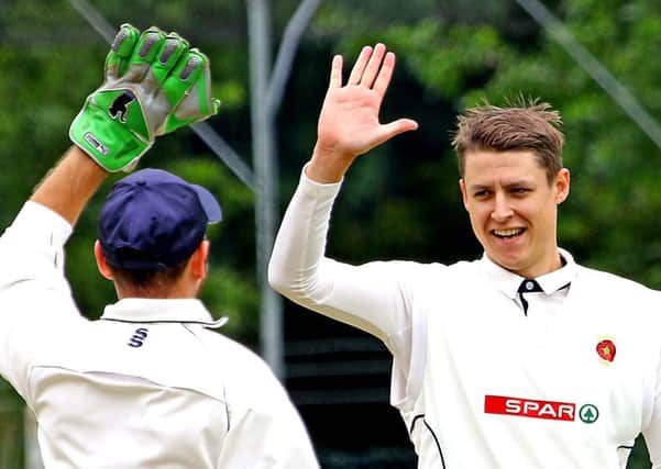 Torrisholme's Matt Jackson celebrates his wicket.