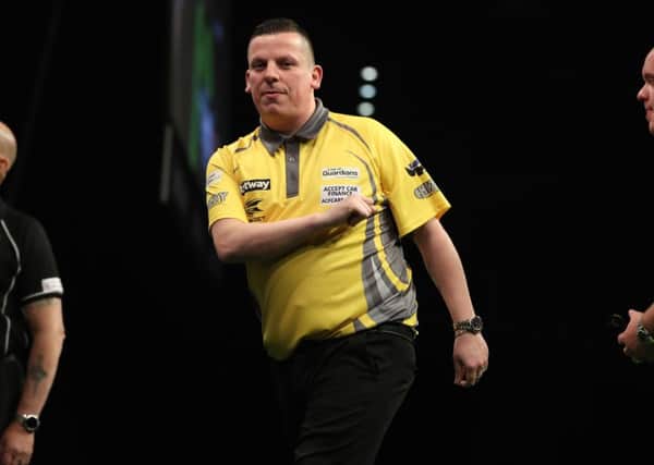 Dave Chisnall takes on Michael van Gerwen in the Betway Premier League at the Barclaycard Arena in Birmingham. Picture: Lawrence Lustig.