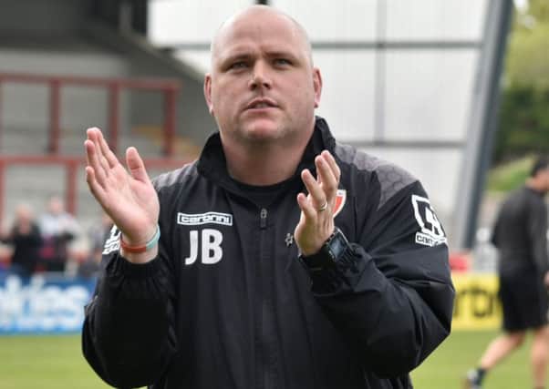 Jim Bentley salutes the home fans after the draw with Wycombe.