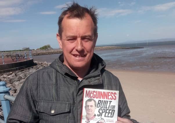 John McGuinness pictured in Morecambe last week with his new book, before Thursday's crash.