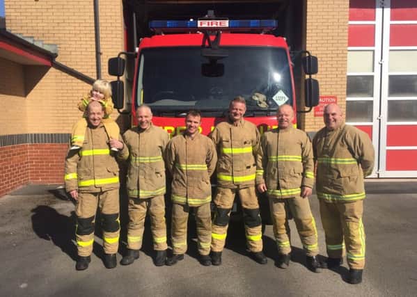 Firefighters from Morecambe Fire Station who are walking 50 miles for the Firefighters charity.