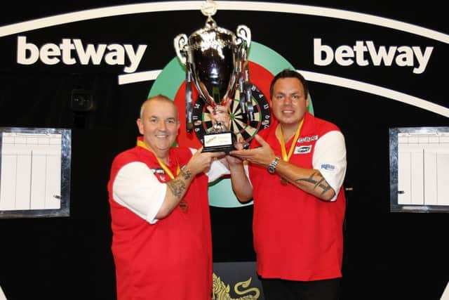Phil Taylor and Adrian Lewis won the title for England 12 months ago. Picture: Lawrence Lustig